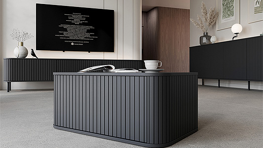 Black furniture in the living room - how to avoid the overwhelming effect?